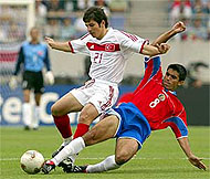 Turkey's Emre Belozoglu battles Costa Rica's Mauricio Solis