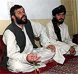 Hamidullah Tokhi, Governor of Zabul province where many Taliban sympathisers live, and Abdul Bari, head of the Governor�s security, discuss the upcoming Loya Jirga