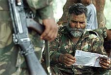 A soldier reads a letter