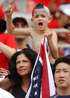 A young supporter of the US soccer team celebrates prior to the South Korea vs USA Group D match