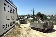 Israeli army troop tank and APC takes up position