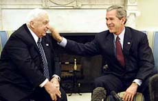 US President George W. Bush pats Israeli Prime Minister