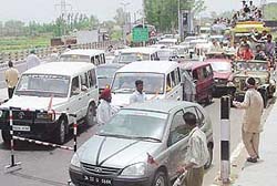 Supporters of Congress candidates create chaos at the toll tax collection centre on the busy Chandigarh-Ambala highway near Dera Bassi on Monday afternoon.