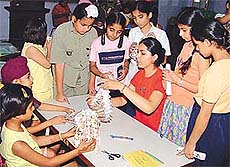 Children learn the art of making lampshades