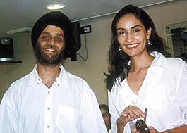 Lighting up the place with her ear-to-ear smile, model Simmar Duggal stands besides Mr Pavan Kohli, CEO of Enkay Coffee Shops Pvt Ltd, at the launch of a coffee shop 