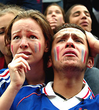 Sorrow is writ large on the faces of French soccer team