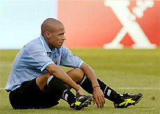 Uruguay�s Gustavo Varela sits alone