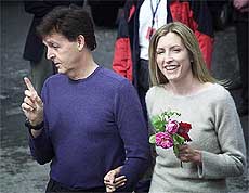 Former Beatle Sir Paul McCartney and bride-to-be Heather Mills joke with the media