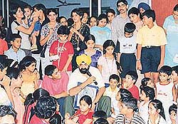 Jaspal Bhatti interacts with children on the concluding day of the summer workshop at Bal Bhavan, Sector 23, Chandigarh, on Wednesday.