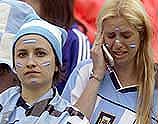 An Argentina fan talks on a mobile phone