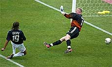 Argentina's Hernan Crespo shoots past Sweden's goalkeeper