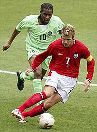 England's captain David Beckham controls the ball
