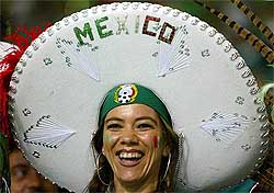 A Mexico fan wears a sombrero