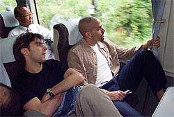 Argentina's Claudio Lopez and Juan Sebastian Veron sit on a train