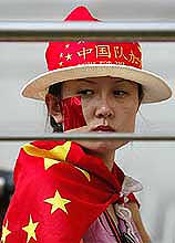 A Chinese fan reacts after China lost to Turkey 