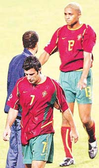 Portugal's Luis Figo and team-mate Horge Andrade