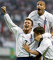 England's captain David Beckham, Rio Ferdinand and Michael Owen celebrate Owen's goal