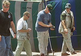 American investigators search for evidence outside the US consulate in Karachi 