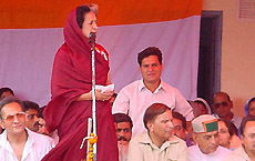 Ms Vidya Stokes addresses a Congress sammelan at Bhareri in Hamirpur on Sunday.