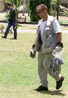 US investigators search for evidence in front of the US Consulate