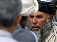 Delegates debate during a recess in Kabul