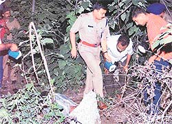 The SSP, Mr Parag Jain, carries out investigation in a jungle near the Panjab University campus where a man was found murdered in Chandigarh on Monday evening.