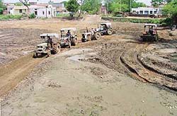 Residents of Mullanpur-Garibdas village do �kar sewa� to put a village pond in order on Sunday.