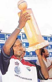 West Indies captain Carl Hooper holds the trophy