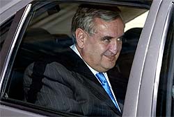 French Prime Minister Jean-Pierre Raffarin leaves the Elysee Palace on Monday after handing in the resignation of his government.
