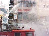 Fire fighters tackle the blaze at a consumer goods shop in Ambala Sadar on Wednesday.