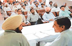 Local Member of Parliament Pawan Bansal and chairman of the local Panchayat Samiti, Mr Bhupinder Singh Badheri, at a meeting of Sarpanches, Panches, Panchayat Samiti and Zila Parishad members 