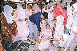 Family members of the deceased being consoled at the dharna staged by safai workers