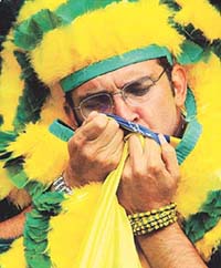 A soccer fan kisses the Brazilian flag at the end of the England/Brazil quarter-final match on the World Cup at Shizuoka Stadium on Friday.