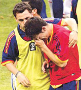 Spain's Fernando Morientes (R) is comforted by team-mate Sergio after South Korea beat Spain 5-3 on penalties in their World Cup quarter-final in Kwangju on Saturday. 