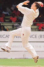 New Zealand bowler Shabe Bond winds up against the West Indies during the second day of the first test in Bridgetown, Barbados 