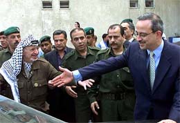 Palestinian President Yasser Arafat greets Jordanian Foreign Minister Marwan Muasher