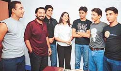 Students of Arclight Academy of Modelling and Applied Arts with the faculty members at the passing out ceremony of the academy in Sector 34, Chandigarh, on Monday.