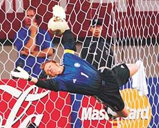 Germany�s goalkeeper Oliver Kahn makes a diving save on a shot by South Korea�s Lee Chun-soo 