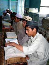 Muslim students learning Islamic studies in a madarsa 
