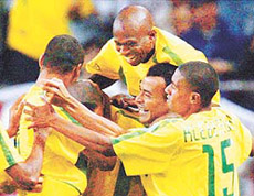 Brazil's Ronaldo (C) is mobbed by team-mates Rivaldo (L), Edilson (top), Cafu (2nd L) and Kleberson (R) after scoring against Turkey during their World Cup semifinal match in Saitama on Wednesday.