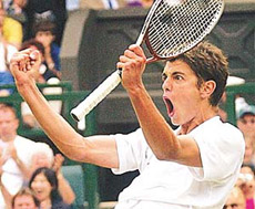Mario Ancic of Croatia reacts as he defeats Switzerland's Roger Federer.