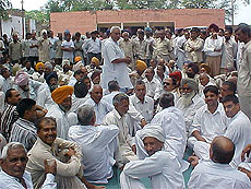 Farmers gather at the power house
