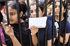 In or Out: Students checking the first cut-off list at Khalsa College