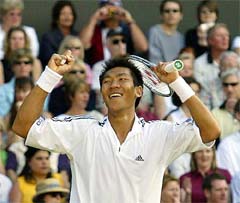 Thailand's Paradorn Srichaphan smiles after beating number three seed Andre Agassi