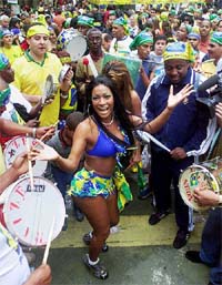 Brazilian soccer fans dance to Samba rythms 