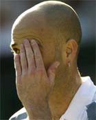 Andre Agassi of the USA wipes his brow