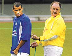 Brazilian head coach Luiz Felipe Scolari grimaces as he talks to midfielder Rivaldo during the team's training session 