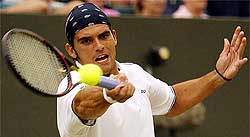 Australia's Mark Philippoussis returns to Germany's Nicolas Kiefer