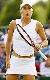 Russia's Anna Kournikova pauses during her doubles match