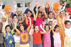 Participants wave to their parents at the concluding day of a summer workshop